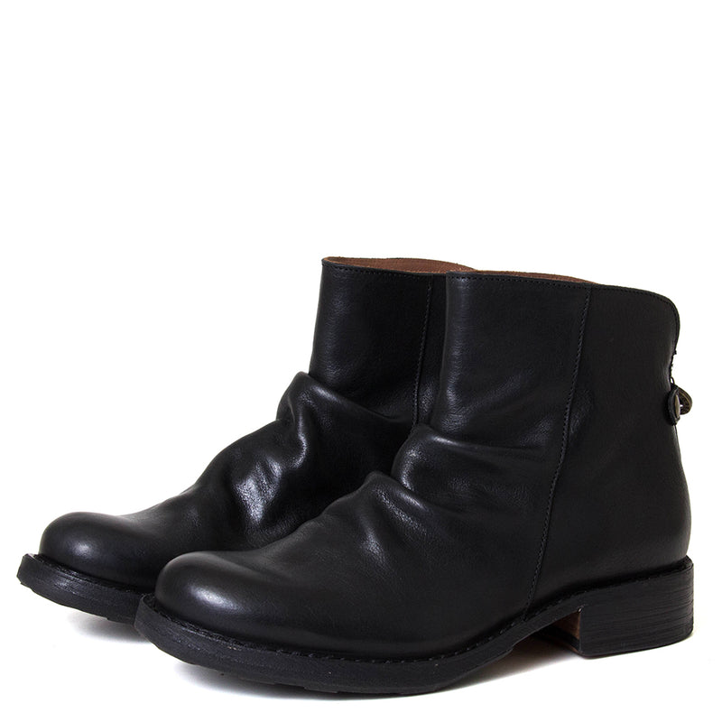 Pair of black leather ankle boots on a white background