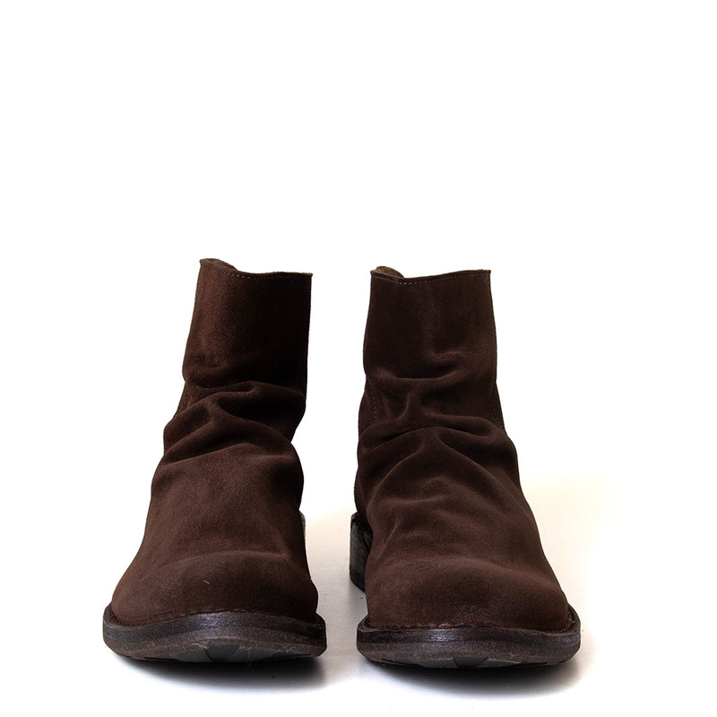 Pair of brown suede boots on a white background
