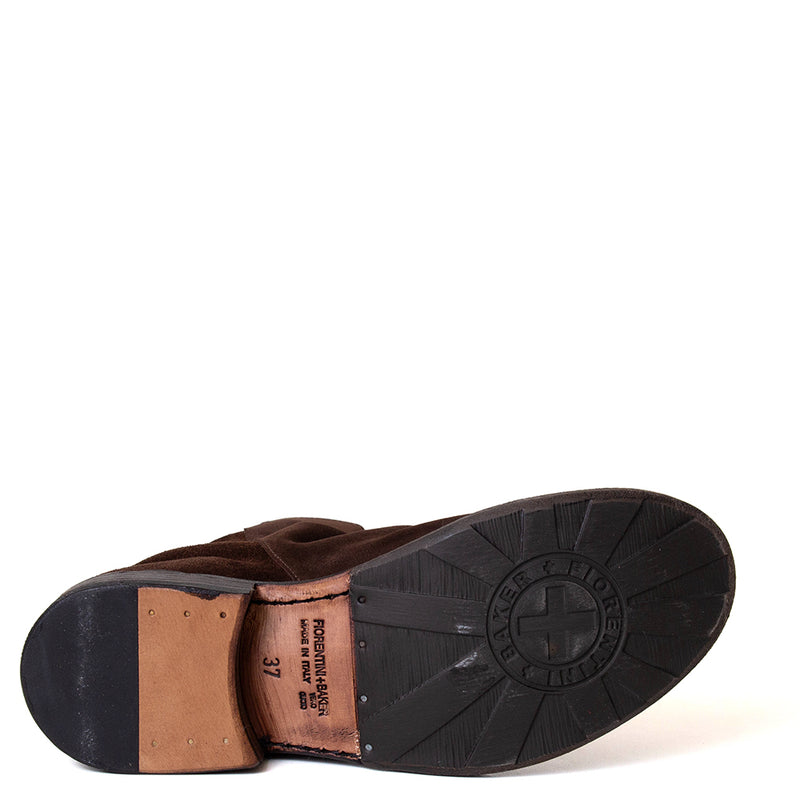 Close-up of a brown leather shoe sole with brand logo on a white background