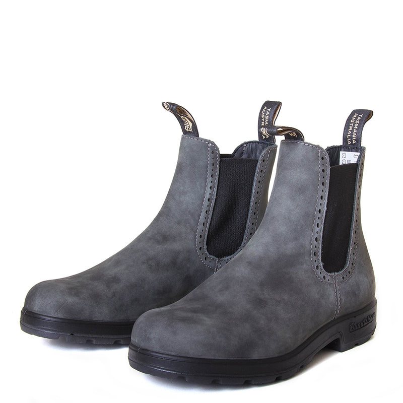 Blundstone Women's 1630 Chelsea Boot in Rustic Black. Built to last. Perfect of everyday wear. Durable material, with comfortable shock absorption insole. Rubber sole. Front view, pair.