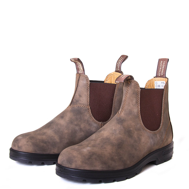 Blundstone Women's 585 Chelsea Boot in Rustic Brown. Built to last. Durable material, with comfortable shock absorption insole. Rubber sole. Front view, pair.